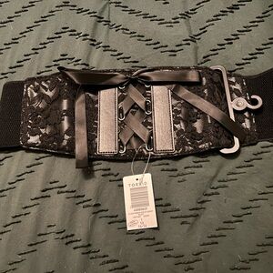 Cute lace black belt with a pair of rhinestone safety pin earrings.